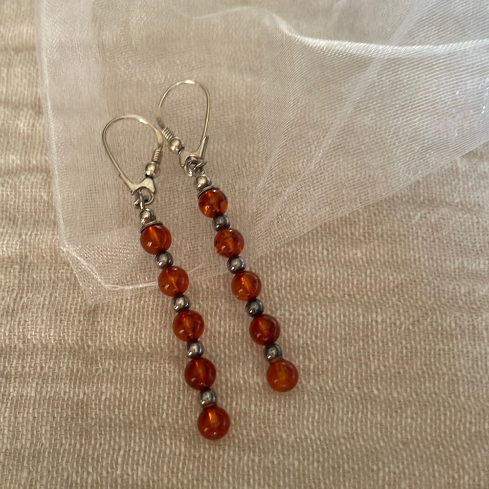 Amber earrings with silver Shepard hook closure